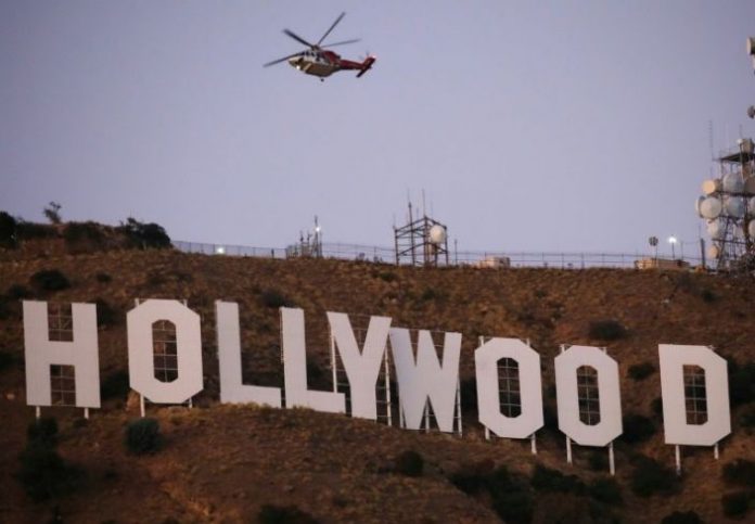 Six held after Tinseltown’s famous sign changed to ‘Hollyboob’