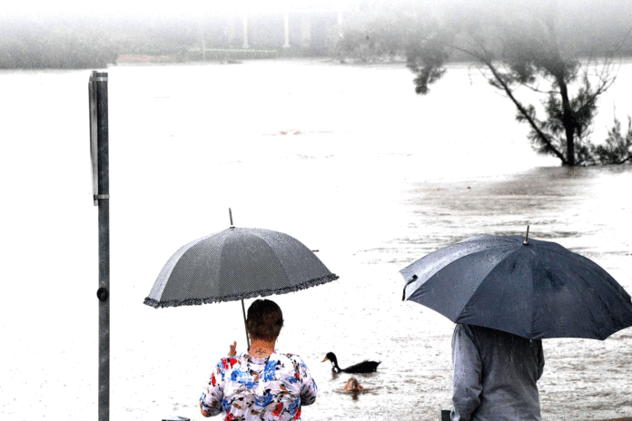 Evacuations ordered as dam overflows