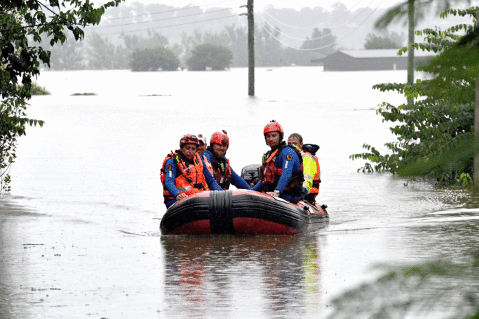 Thousands evacuate in N S Wales as floods worsen