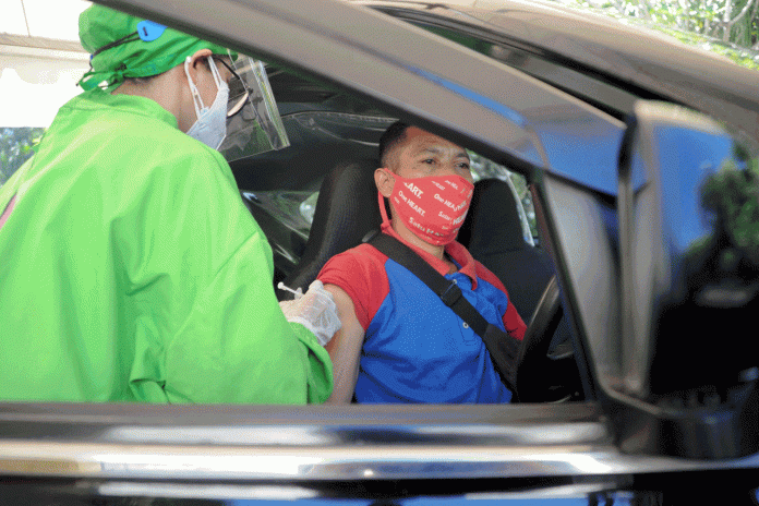 Bali kicks off drive-thru virus jabs for hospitality workers
