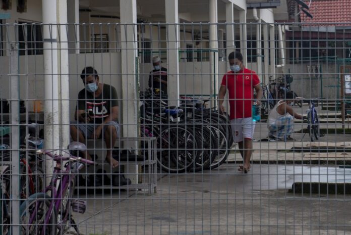HR minister: 59 employers facing charges over workers’ accomodation
