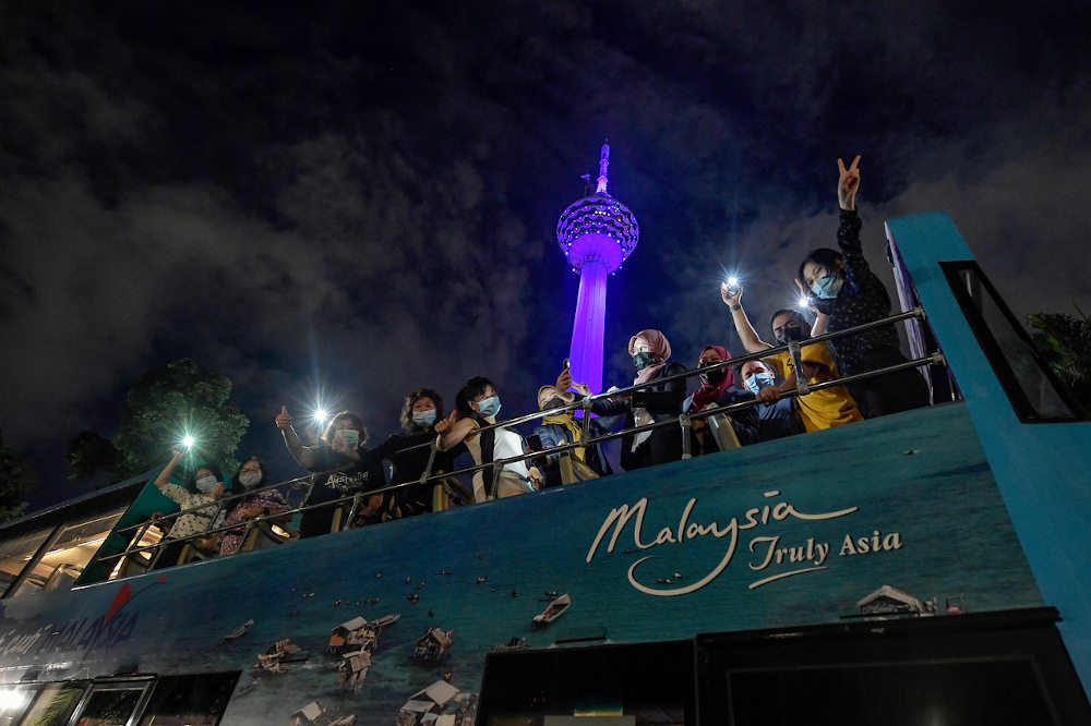 Exploring Kuala Lumpur city night view on Hop-On Hop-Off buses