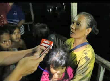 Mother, 7 children jump into river to escape fire