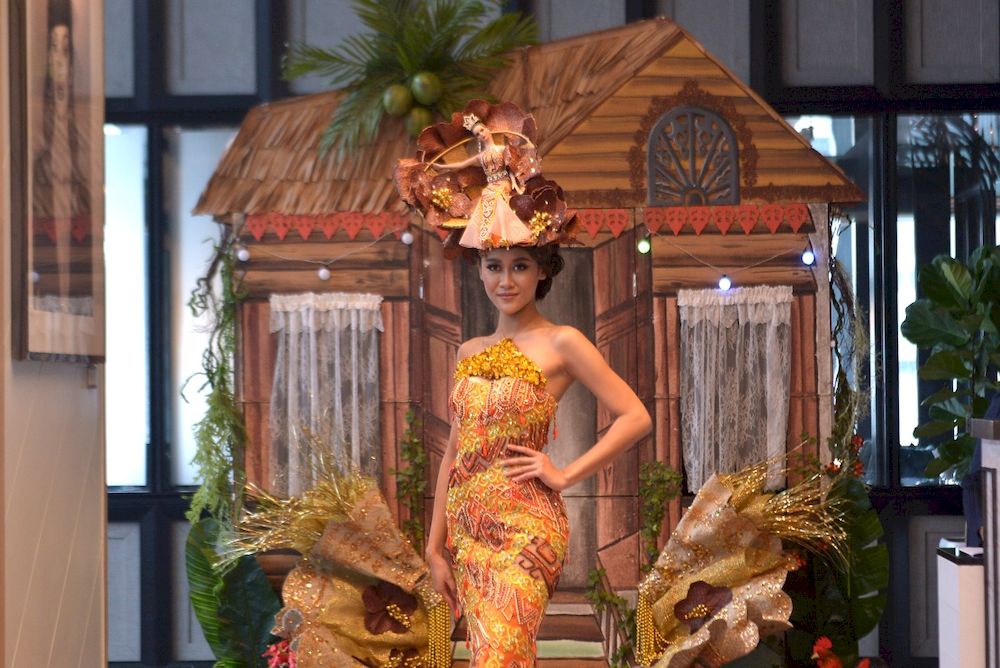 Replica chickens, coconut trees: 3D traditional kampung house is Miss Universe Malaysia 2020’s national costume