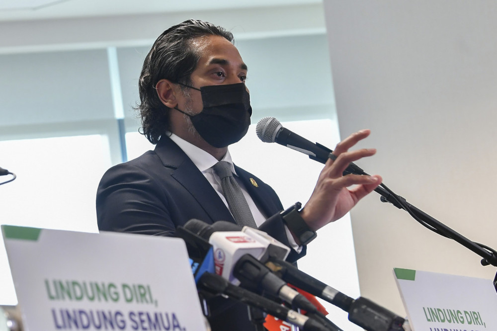 Putrajaya says refugees, migrant workers to be vaccinated in third phase around June, even if undocumented