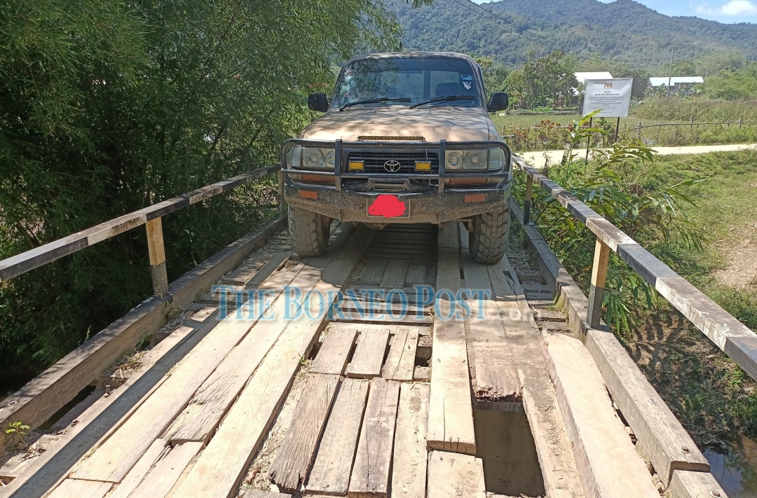 Wooden bridge connecting SK Ba Kelalan, Long Langai to the outside world in dire need of repair