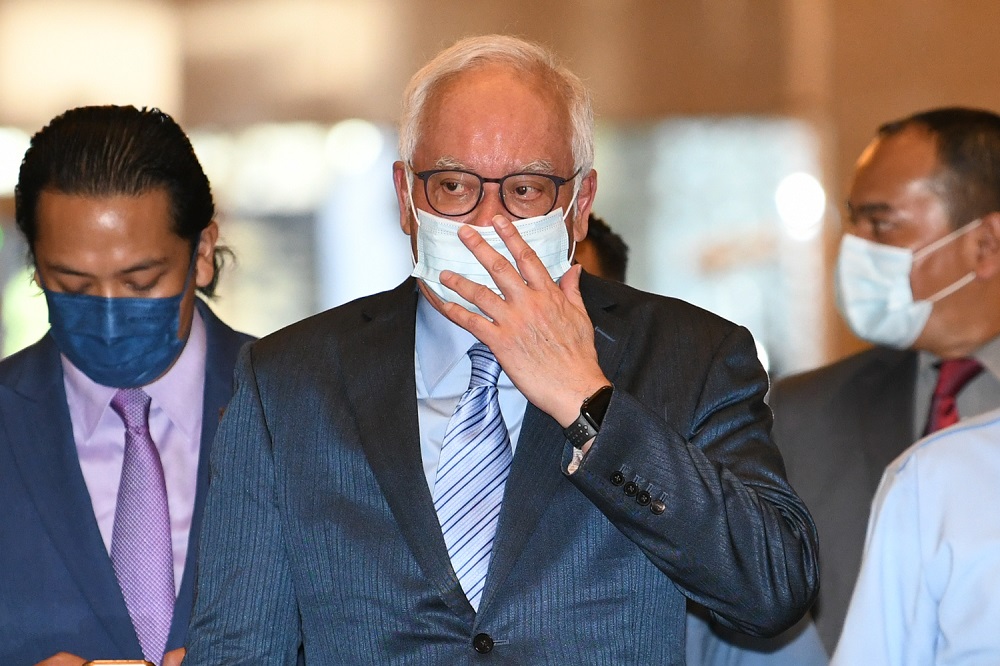 Najib claims bankruptcy notice an attempt to disqualify him as MP after poll puts him as frontrunner to be PM again