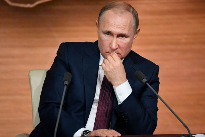 Putin signs law allowing him to serve two more terms