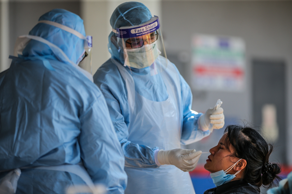 Swamped by rising Covid-19 patients, Health Ministry asks Malaysians not to blame it for balik kampung frustrations