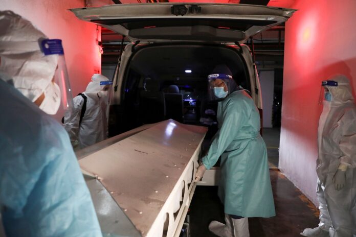 Malaysian volunteer undertakers struggle to cope as Covid-19 cases surge
