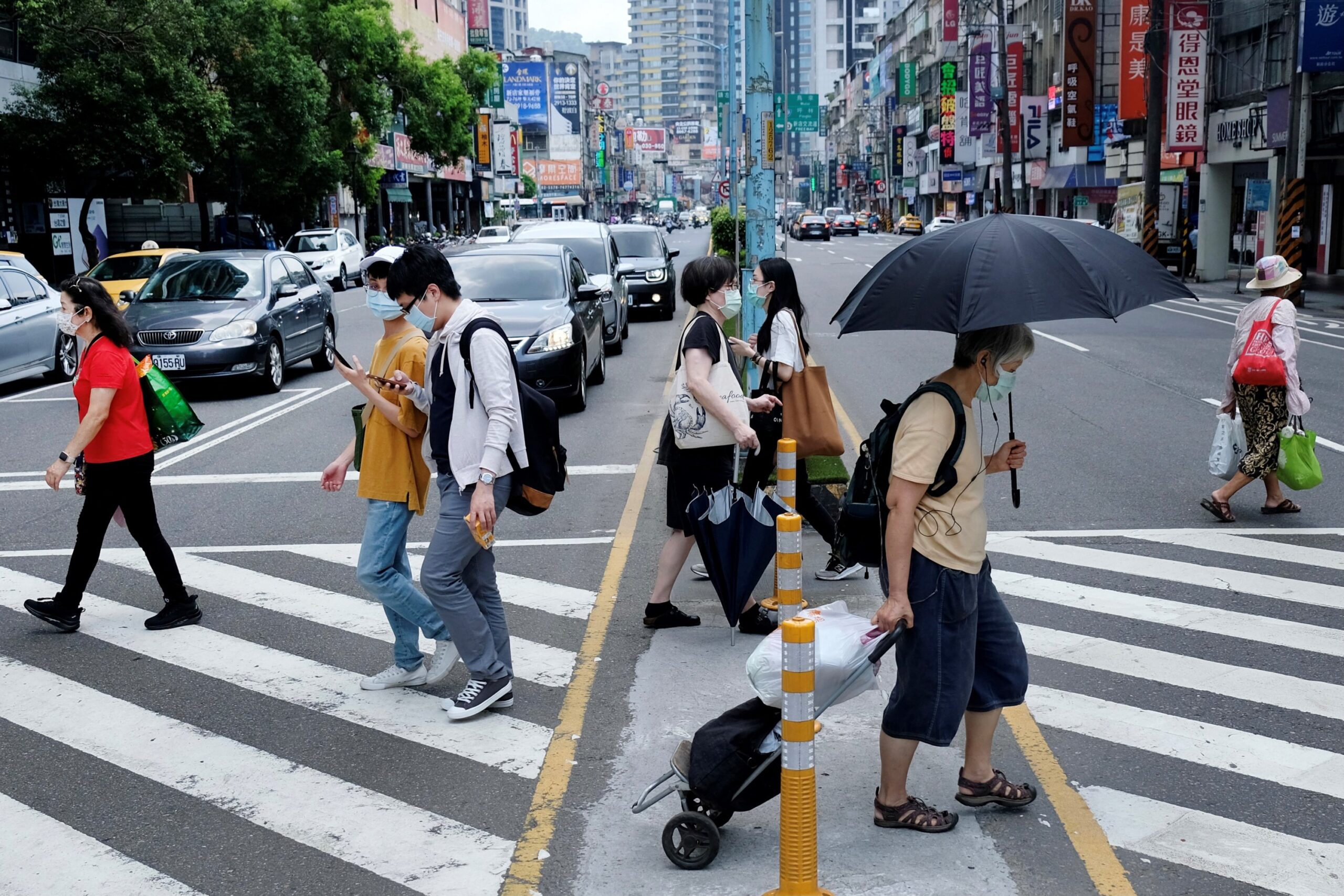 Taiwan raises alert level after Covid-19 cases surge