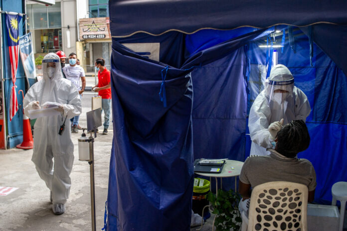 In sign of worsening situation, Malaysia exceeds 8,000 daily Covid-19 cases a week ahead of projection