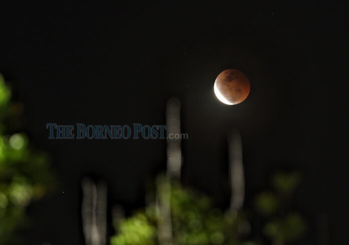 Spectacular ‘Super Flower Blood Moon’ lunar eclipse over Kuching