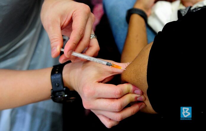 Muhyiddin: Vaccinating as many people as possible ‘only way out’ from Covid-19