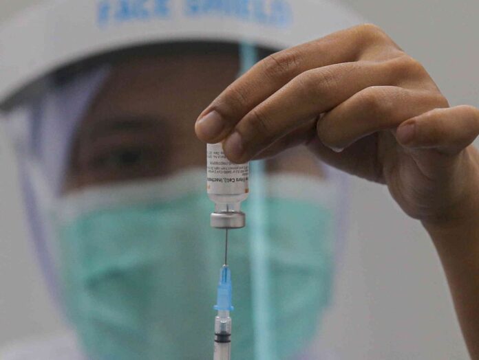 Adopt ‘jab first, register later’ approach to flatten Malaysia’s Covid-19 curve, govt told