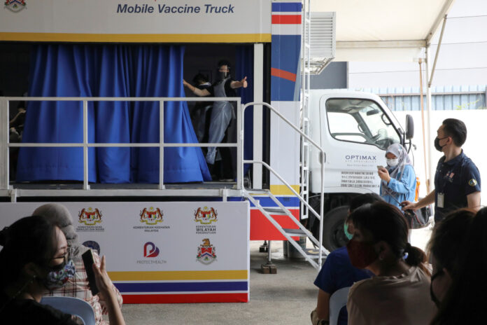 Shots on wheels: Malaysia goes mobile with mass Covid-19 vaccine rollout