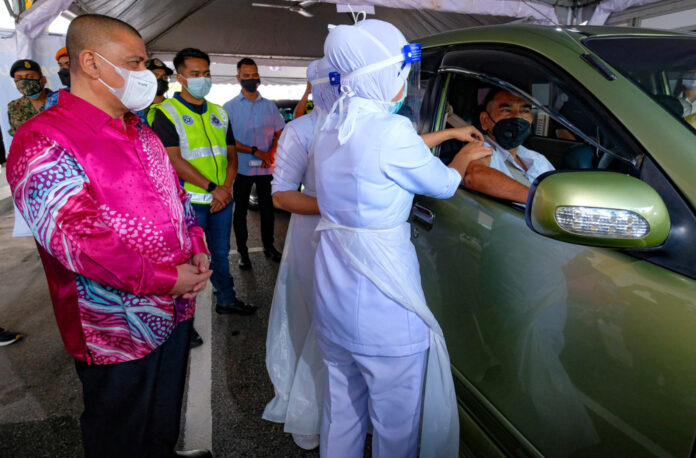 Covid-19: Perak’s first drive-through vaccination centre makes getting jabbed a breeze