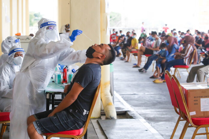 Malaysia’s new Covid-19 cases climb over 13,000 again for second time in July