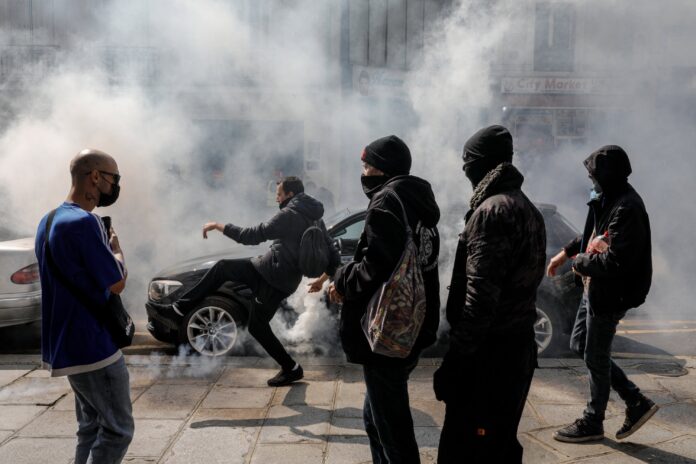 French police fire tear gas as thousands protest against virus rules