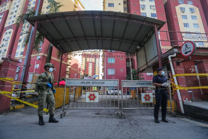 After weeks of lockdowns, Malaysia’s new Covid-19 cases hit record high of 9,180