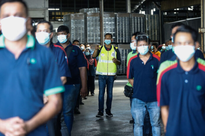 Violation of Covid-19 SOPs: Local authorities have the power to close factories, says minister