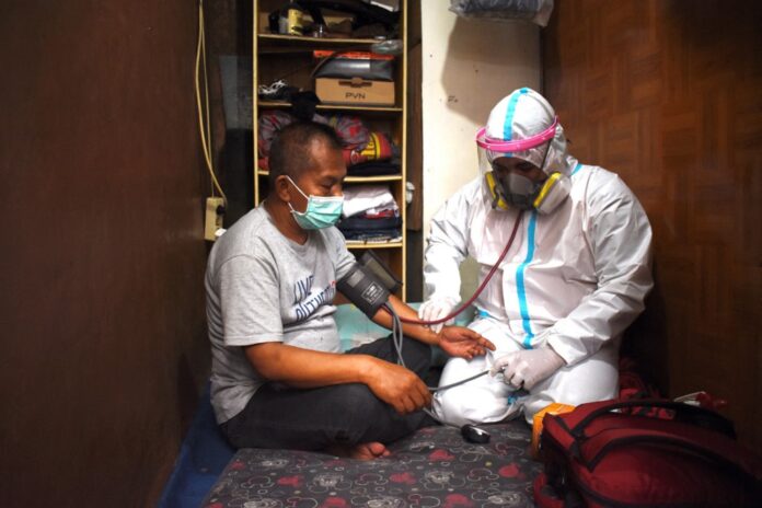 Virus-wracked Indonesia hits 100,000 deaths