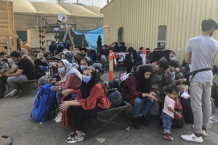 Taliban pledge to be ‘different’, as Afghans flee