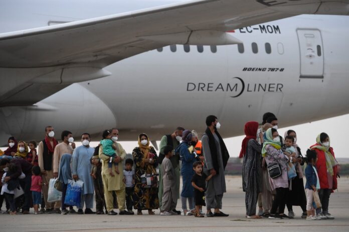 Afghans race to flee Taliban after Biden confirms airlift deadline