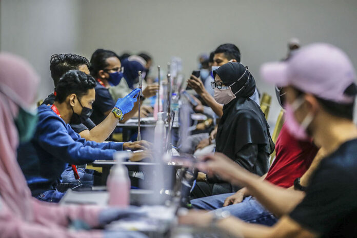 PM Muhyiddin: National Covid-19 Immunisation Programme shows positive sign with drop in categories three to five cases