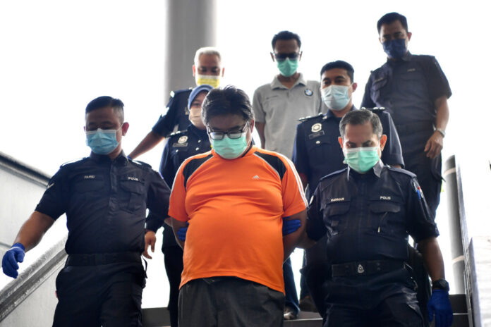 Two businessmen plead not guilty to selling, forging letters conferring fake Melaka state awards, medals