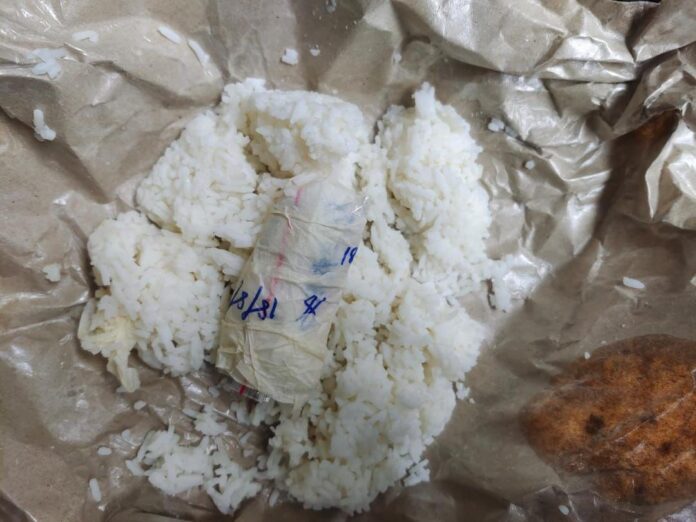 Duo arrested after drugs found hidden in food packet delivered to Kota Samarahan EMCO village