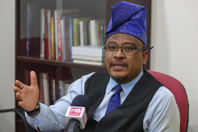 Putra veep Buzze Azam charged with insulting judiciary, police on Facebook