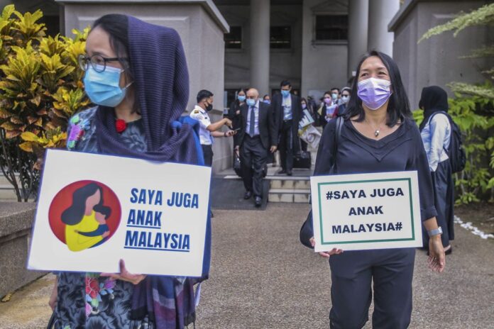 Group tells home minister to end discrimination against Malaysian mothers seeking citizenship for children born abroad