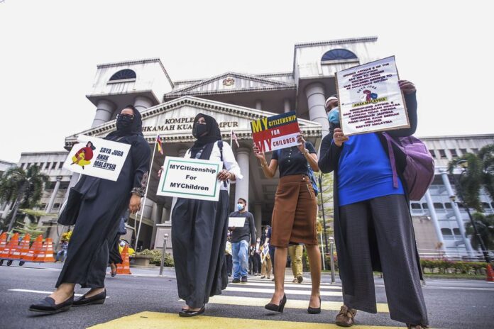 Home minister: Appeal against ruling on Malaysian mothers to seek more time for Constitution amendment
