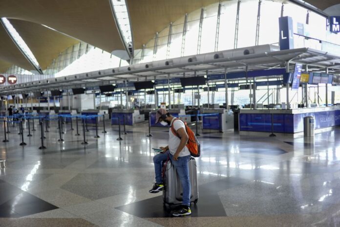 Home minister: Opening of borders to be decided after Malaysia moves into Covid-19 endemic phase