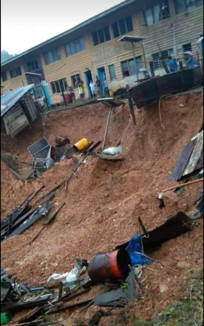 Storage huts in front of longhouse collapse in landslip