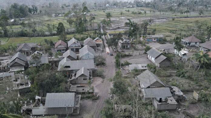 Indonesia volcano erupts again, hampering rescue operations