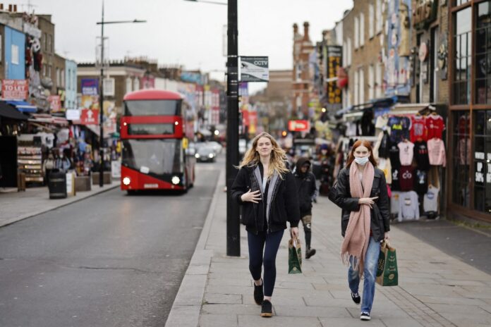 England cuts Covid isolation period to boost economy