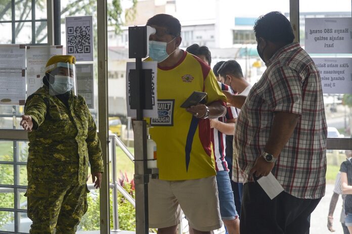 Khairy: Temperature scans to be dropped from Covid-19 SOPs