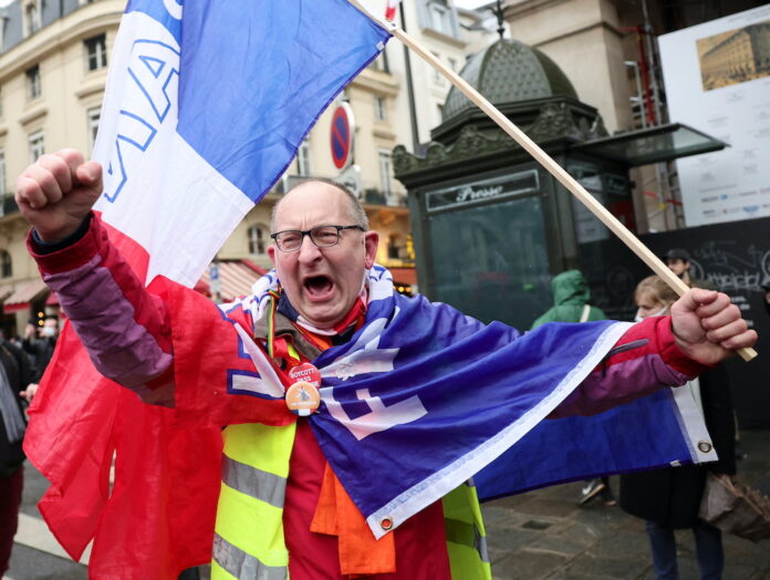 Anti-vax protesters tell France's Macon: 'We'll piss you off'