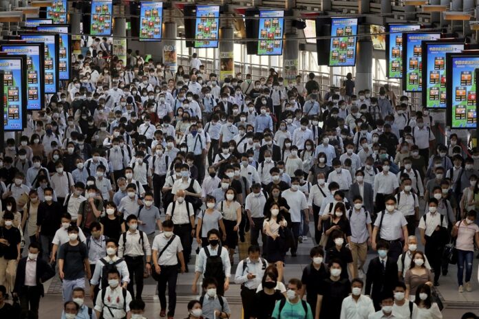 Japan poised to widen Covid-19 controls as Omicron drives record infections