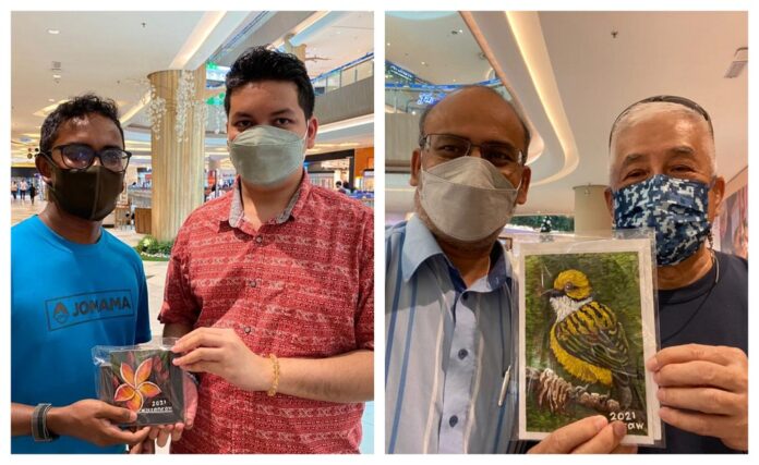 WIth supportive parents, Kedah artist with Asperger's syndrome thrives in his artwork and exhibitions