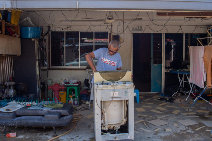 Tired of waiting, Taman Sri Nanding residents count on themselves to clean up, rebuild after floods