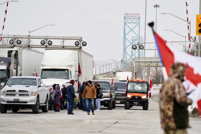 Canada provinces move to ease Covid rules as trucker protest hardens