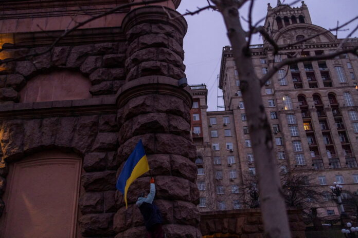 'We fear no one:' Ukrainians raise flags to defy Russia invasion fear