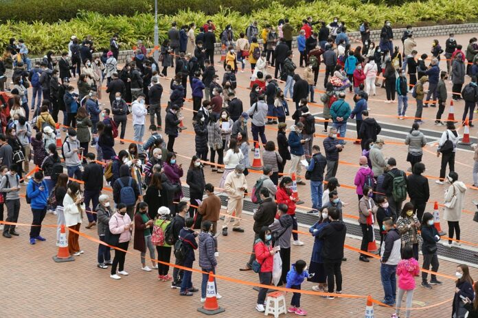 Hong Kong leader says fifth Covid wave has 'overwhelmed' city's capacity