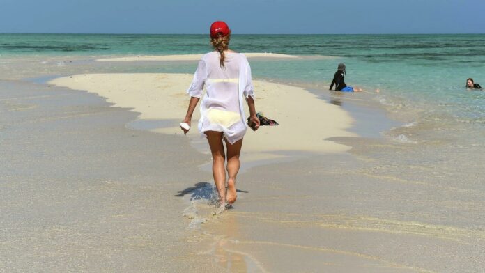 Australia to reopen borders to tourists on Feb 21