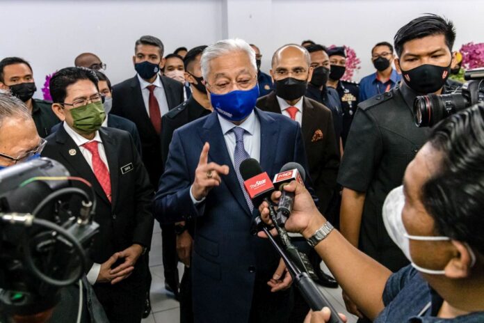 Violation of Covid-19 restrictions 'not a crime', says PM amid calls for Hishammuddin to step down