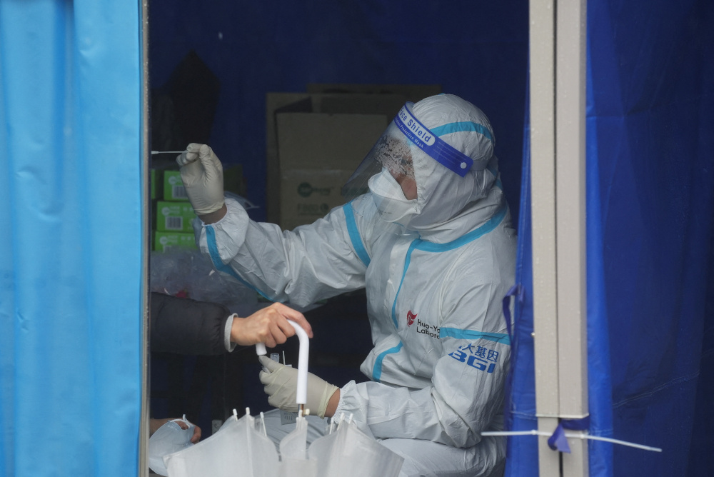 Hong Kong to launch vaccine pass as Omicron outbreak rages