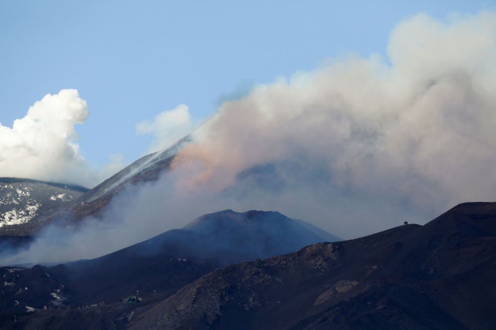 Italy's Etna spews smoke and ashes, closing airport